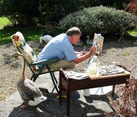 Architect and author Christopher Alexander, painting at his home in England